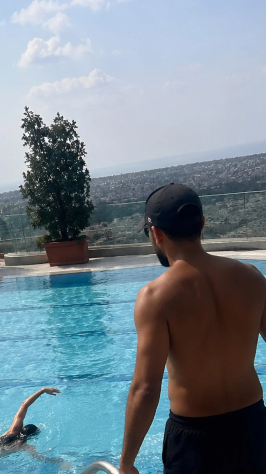 SafeSwim coach watching a swimmer from poolside