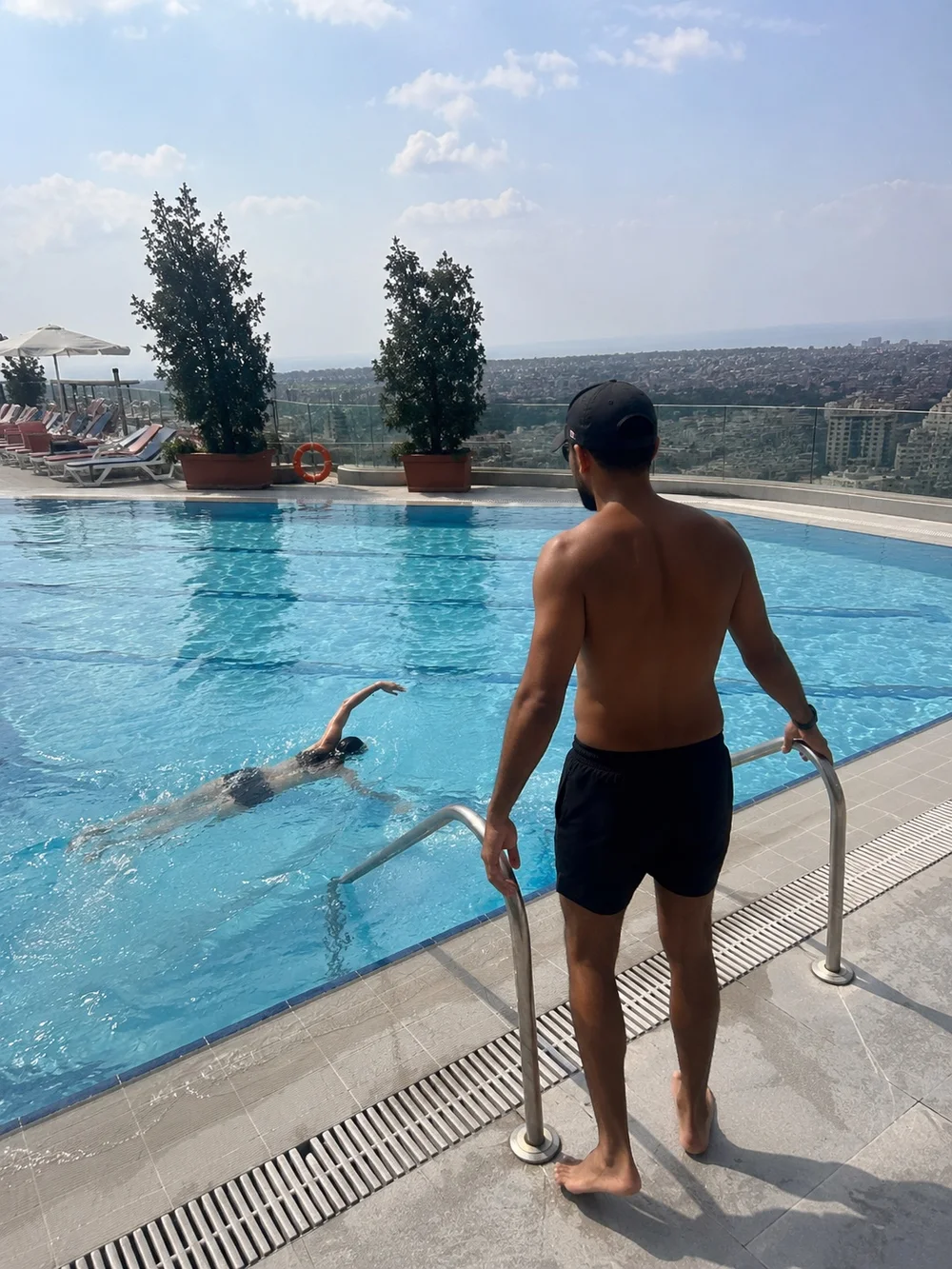 SafeSwim coach observing a swimmer during an outdoor lesson